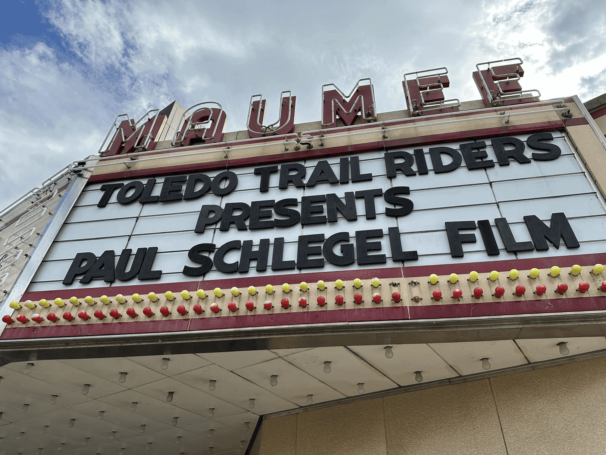 A billboard advertising the documentary for Paul Schlegel: The Godfather of Motorcycle Racing